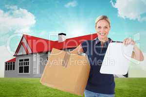 Composite image of happy delivery woman holding cardboard box an