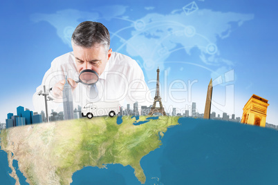 Composite image of mature businessman examining with magnifying