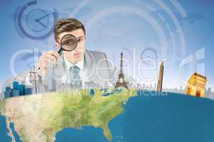 Composite image of businessman with magnifying glass