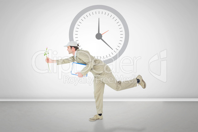 Composite image of delivery man with clipboard offering flower