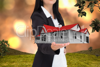 Composite image of pretty businesswoman presenting with hand