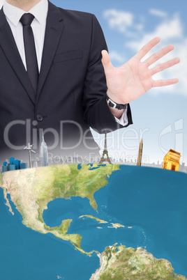Composite image of businessman standing with hands spread out