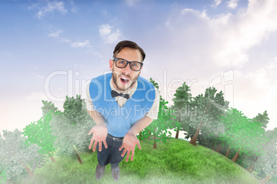 Composite image of geeky hipster looking confused at camera