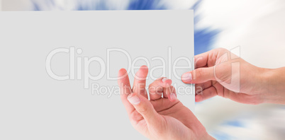 Composite image of hand showing card