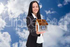 Composite image of pretty businesswoman presenting with hand