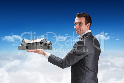 Composite image of businessman presenting with hand