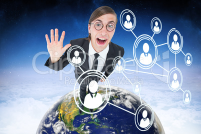 Composite image of geeky businessman waving at camera