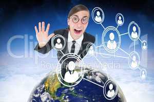 Composite image of geeky businessman waving at camera