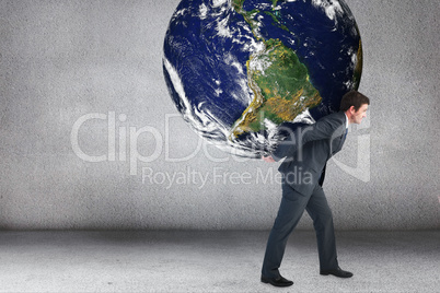 Composite image of businessman carrying the world