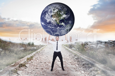 Composite image of businessman carrying the world