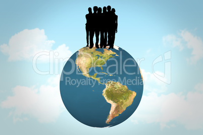 Composite image of silhouette of team of people