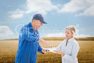 Composite image of happy delivery man with customer