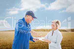 Composite image of happy delivery man with customer