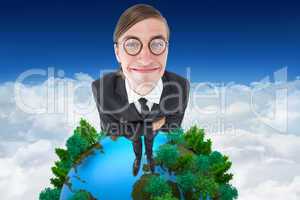 Composite image of geeky businessman smiling at camera