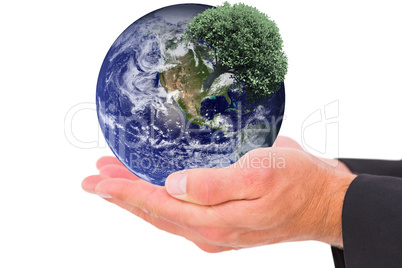 Composite image of businessman holding his hands out