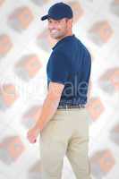 Composite image of happy delivery man wearing baseball cap
