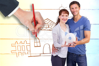 Composite image of couple holding a white piggy bank