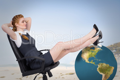 Composite image of businesswoman sitting on swivel chair