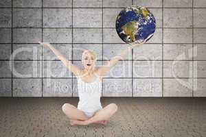 Composite image of toned young woman sitting with arms outstretc