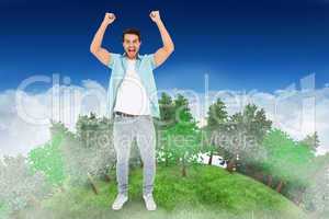 Composite image of happy casual man cheering at camera
