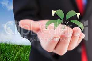 Composite image of businessman presenting with his hand