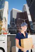 Composite image of happy delivery woman holding cardboard box