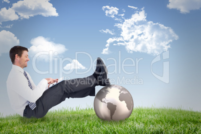 Composite image of businessman using tablet