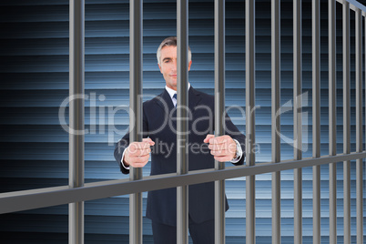 Composite image of businessman showing with hands