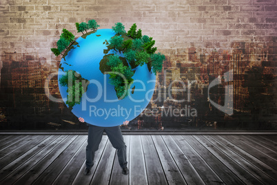 Composite image of businessman carrying the world