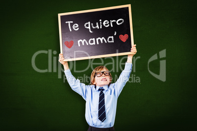 Composite image of cute pupil holding chalkboard