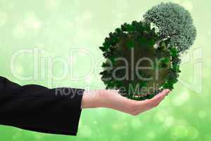 Composite image of businesswomans hand presenting