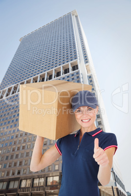 Composite image of happy delivery woman holding cardboard box sh