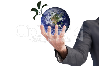 Composite image of businessman presenting with his hands