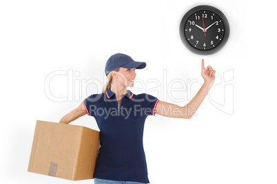 Composite image of happy delivery woman holding cardboard box an