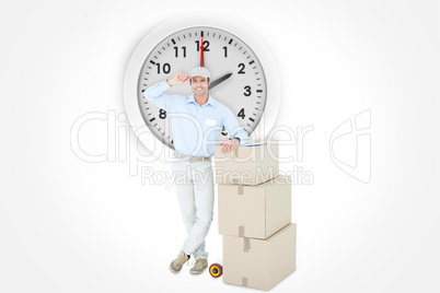 Composite image of happy delivery man leaning on stacked cardboa