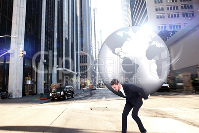 Composite image of businessman carrying the world