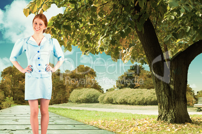 Composite image of pretty air hostess smiling at camera