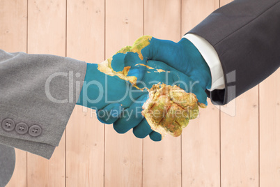 Composite image of handshake between two business people