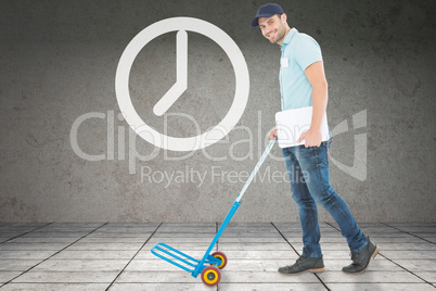 Composite image of confident delivery man pushing empty trolley