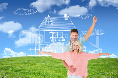 Composite image of attractive couple smiling and cheering