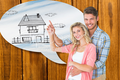 Composite image of attractive young couple embracing and pointin