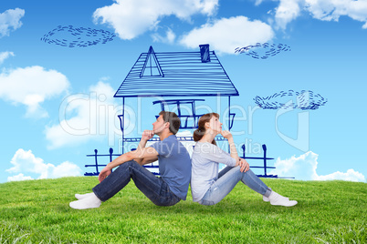 Composite image of couple sitting on floor together