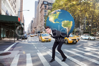 Composite image of businessman carrying the world