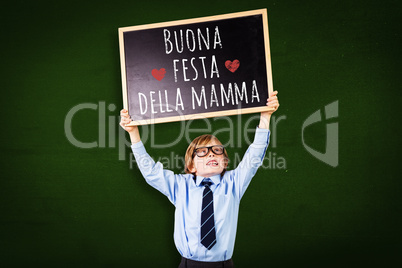 Composite image of cute pupil holding chalkboard