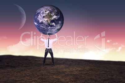 Composite image of businessman carrying the world