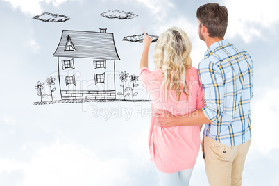 Composite image of attractive couple standing and looking