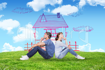 Composite image of couple sitting on floor together