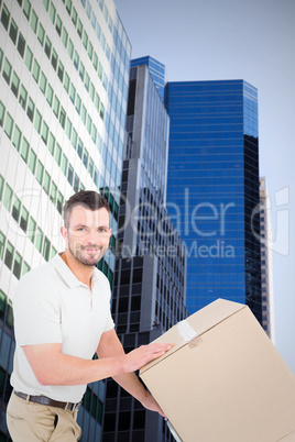 Composite image of delivery man pushing trolley of boxes
