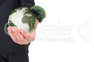 Composite image of businessman holding out his hand