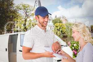 Composite image of happy delivery man getting signature from cus